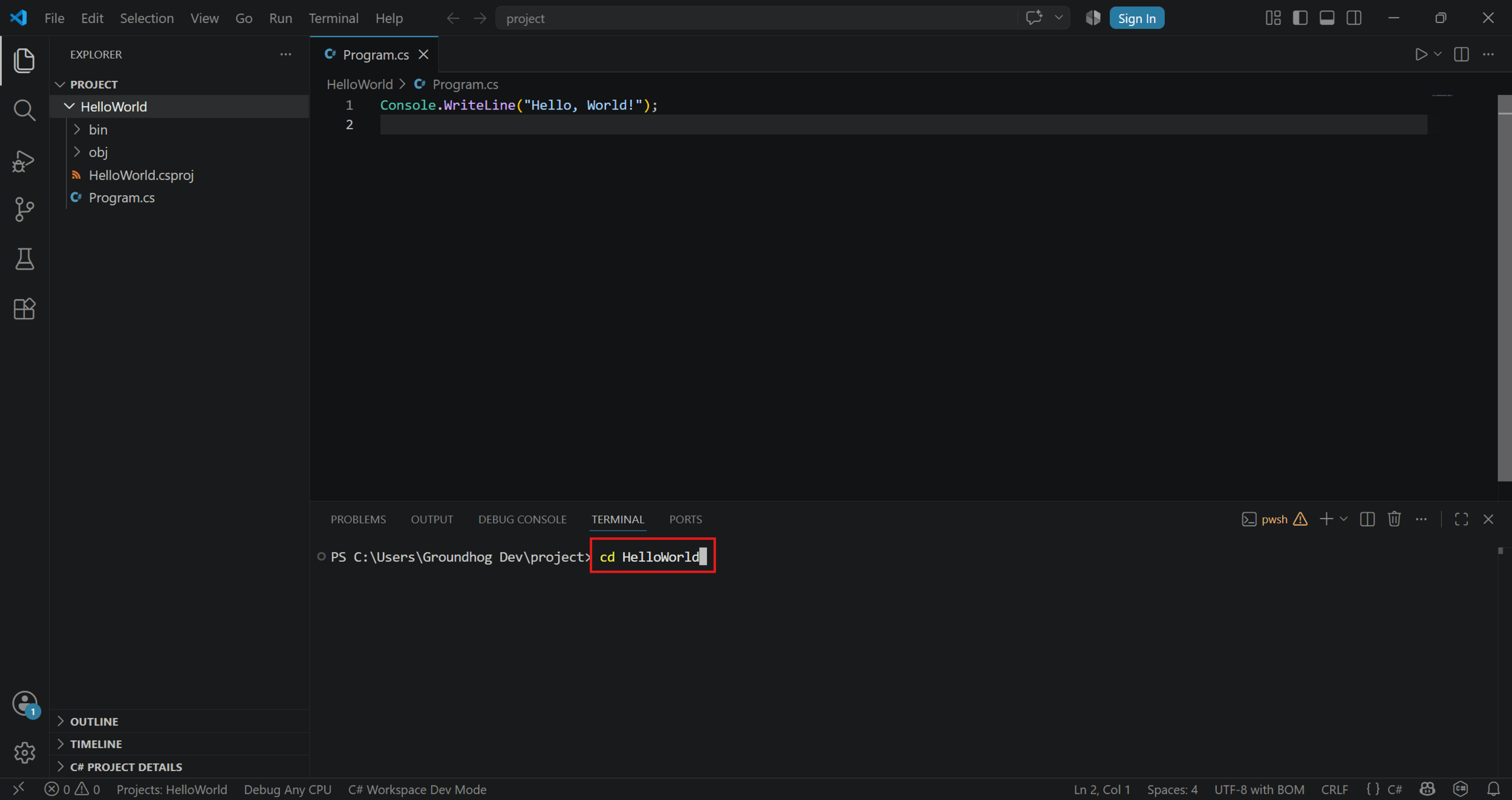 The cd command typed in the terminal to move into the project folder